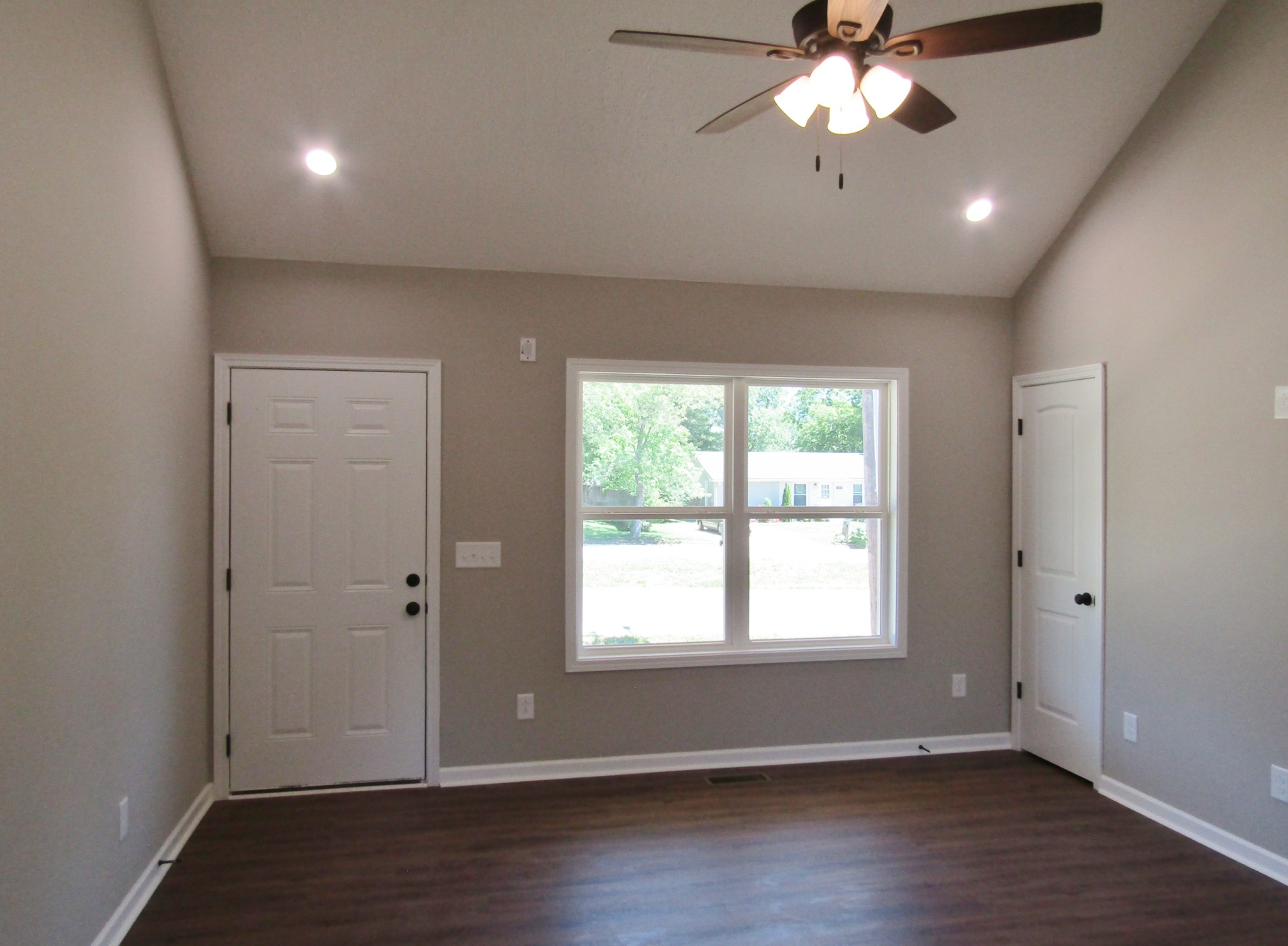 480 Crescent Factory Road Lawrenceburg, TN 38464 - Photo 4 of 14 a view of an empty room with wooden floor and a window