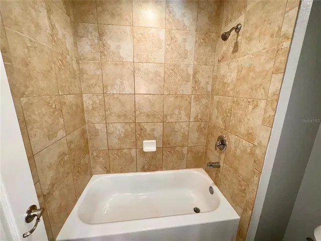 a bathroom with a white bath tub