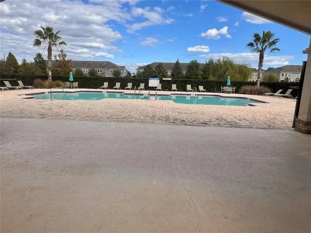 a view of a lake with houses in the back