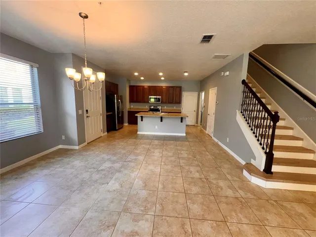 a view of a livingroom with furniture and windows