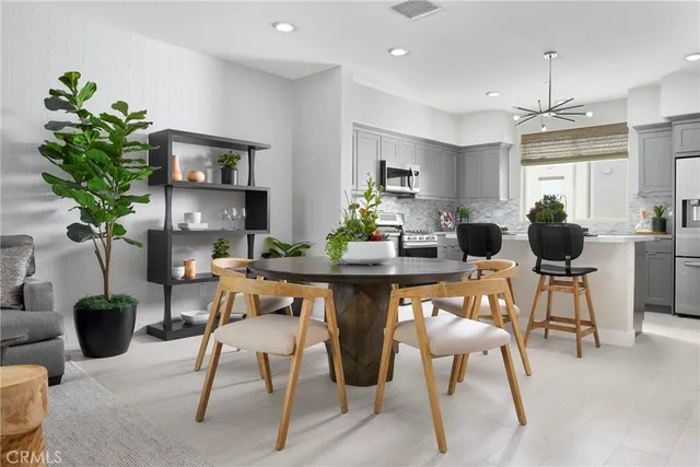 a bedroom with a bed a lamp and window