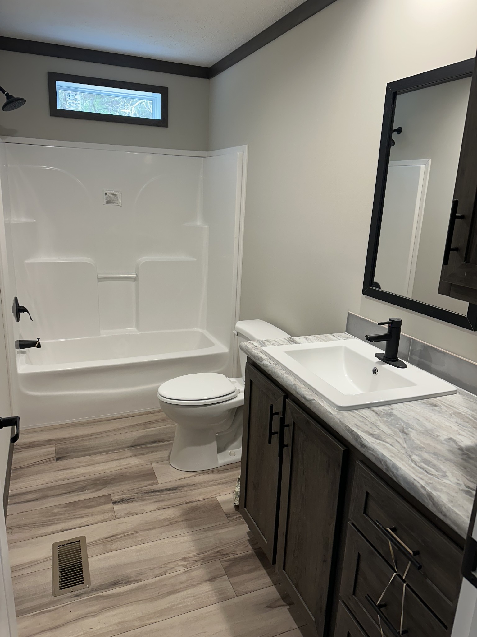3340 Wixtown Road Westmoreland, TN 37186 - Photo 25 of 27 a bathroom with a granite countertop sink toilet and shower