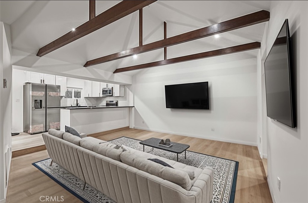 23817 Crest Forest Drive Crestline, CA 92325 - Photo 2 of 9 a living room with furniture and a flat screen tv