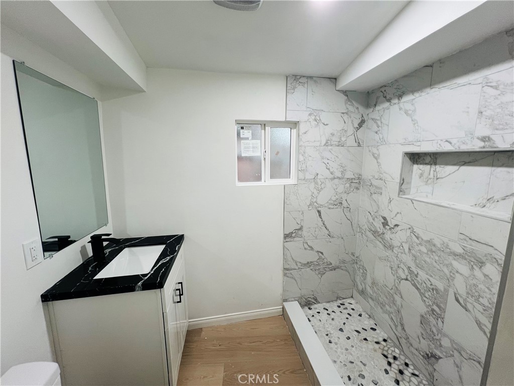 23817 Crest Forest Drive Crestline, CA 92325 - Photo 7 of 9 a bathroom with a sink a toilet and shower