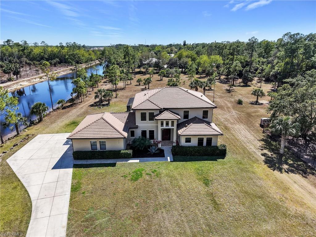 3160 27th Avenue Southwest Naples, FL 34117 - Photo 1 of 43 an aerial view of a house with a garden space