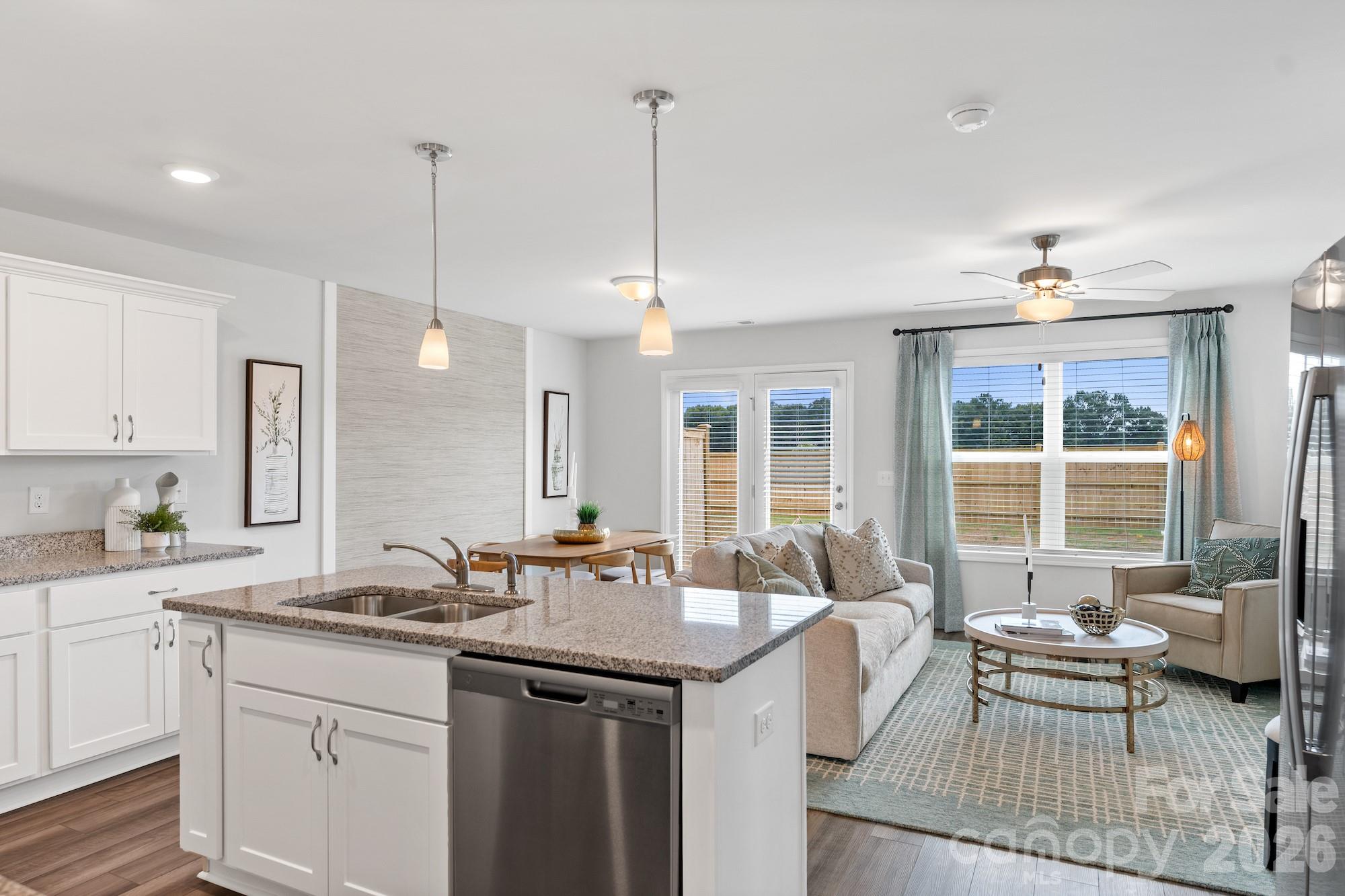3005 Kingsfield Road, Unit 46 Charlotte, NC 28208 - Photo 3 of 15 a kitchen with sink refrigerator and window