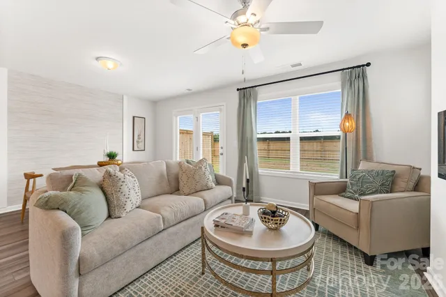 a living room with furniture and a window