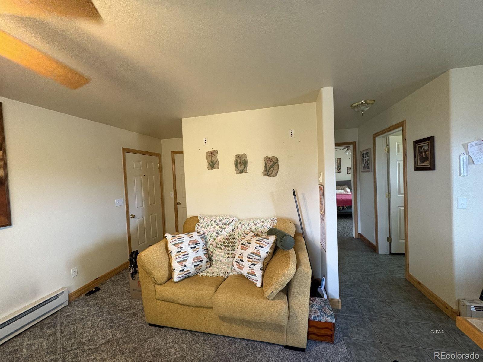 702 Main Street Silver Cliff, CO 81252 - Photo 13 of 20 a en suite bathroom with a granite countertop tub and a shower