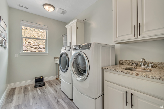 2543 East 700 South Springville, UT 84663 - Photo 39 of 73 Laundry room with light wood finished floors, cabinet space, and separate washer and dryer
