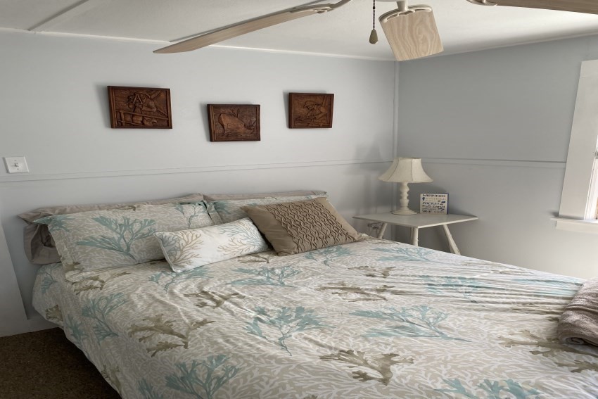 10 Surf Avenue Wareham, MA 02571 - Photo 9 of 14 a bedroom with a bed and a wall painting