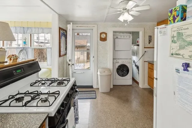 a bedroom with a bed a table and chairs