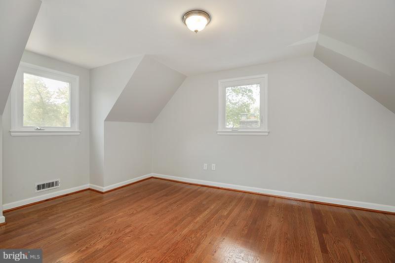 3807 Jeffry Street Silver Spring, MD 20906 - Photo 18 of 26 an empty room with wooden floor and windows