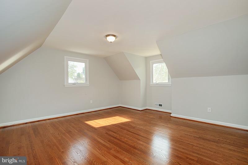 3807 Jeffry Street Silver Spring, MD 20906 - Photo 20 of 26 an empty room with wooden floor and windows