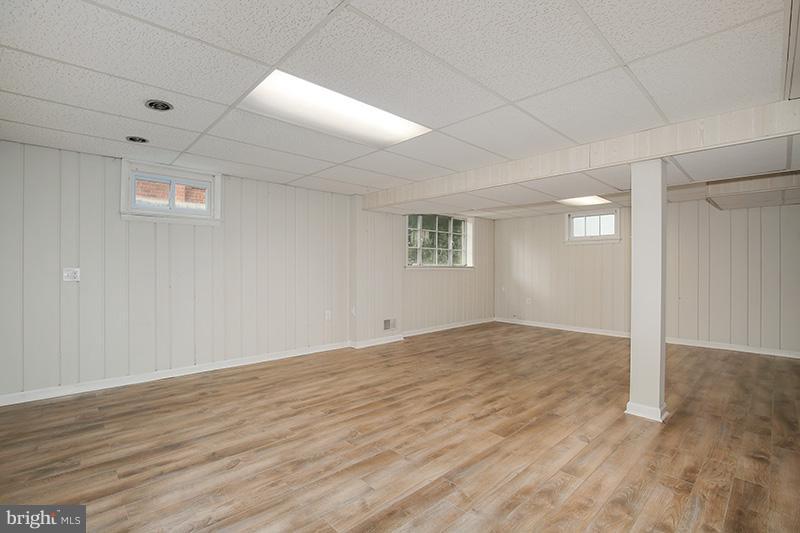 3807 Jeffry Street Silver Spring, MD 20906 - Photo 21 of 26 a view of an empty room with wooden floor and a window