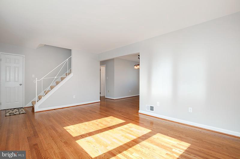 3807 Jeffry Street Silver Spring, MD 20906 - Photo 4 of 26 a view of an empty room with wooden floor and stairs
