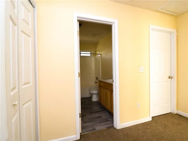 a view of a bathroom from a hallway