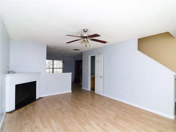 a view of empty room with a fireplace