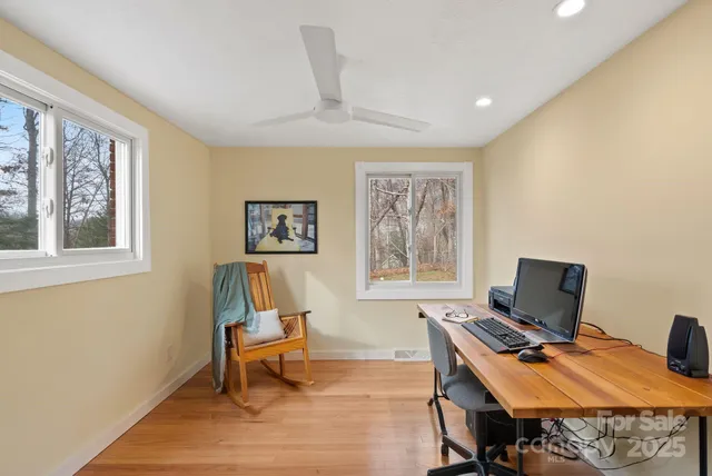 a workspace with furniture and a window