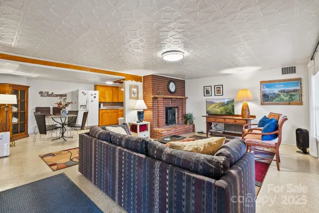 a bedroom with furniture and a book shelf