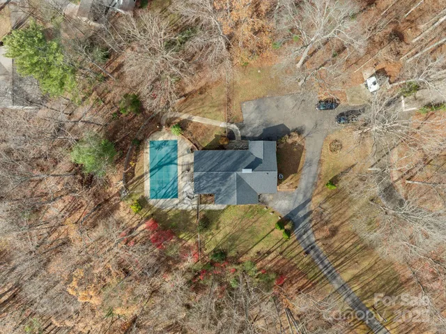 a aerial view of a house with a yard
