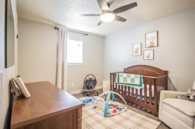a bedroom with furniture and a window