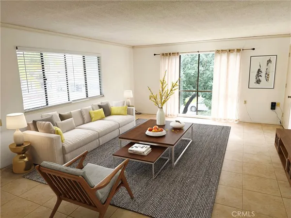 a living room with furniture and large windows