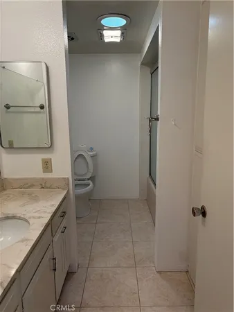 a bathroom with a glass shower door