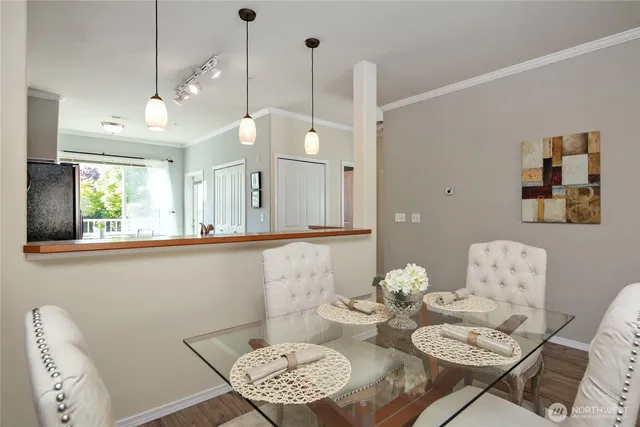a view of a dining room with furniture and wooden floor