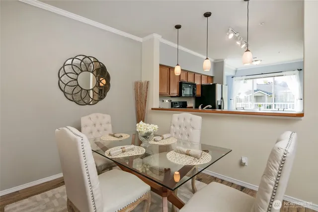 a view of a dining area with furniture and a chandelier