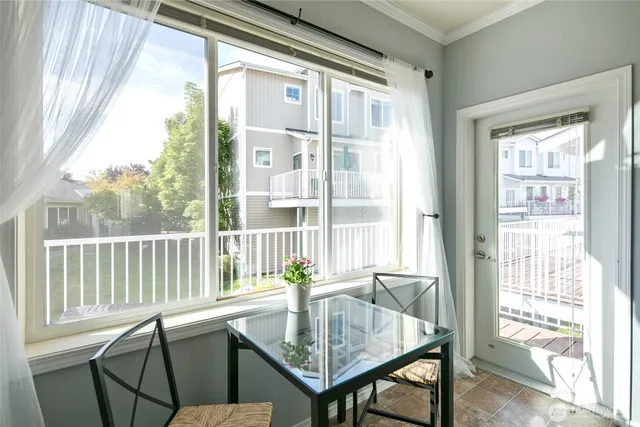a view of a dining room with furniture window and outside view