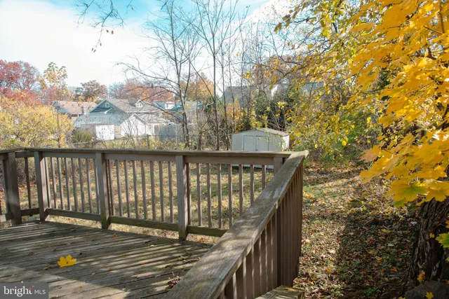 a view of a yard with a house and a trees
