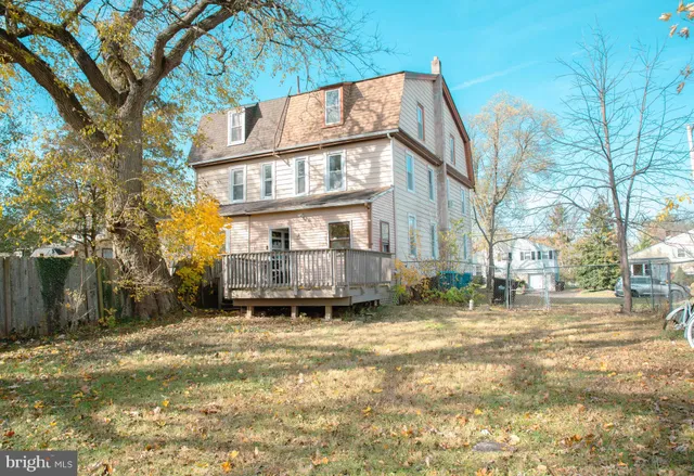 a view of a building with a yard