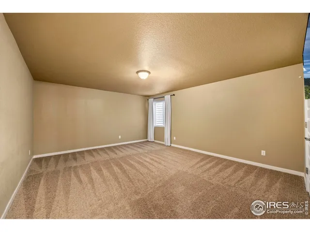 a bathroom with a granite countertop sink a large mirror and a bathtub