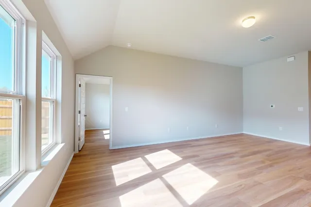 a view of an empty room and window