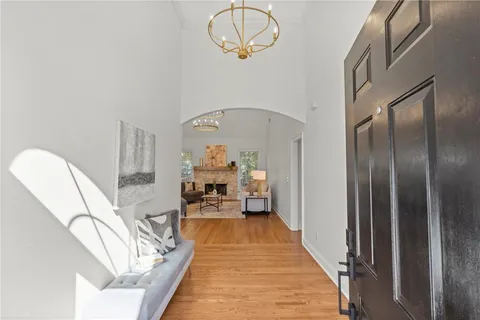 a very nice looking room with a large mirror and furniture