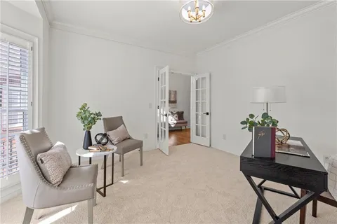 a spacious bedroom with a large bed and a couch