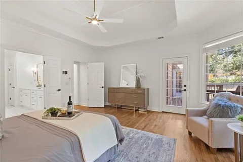 a bathroom with white cabinets