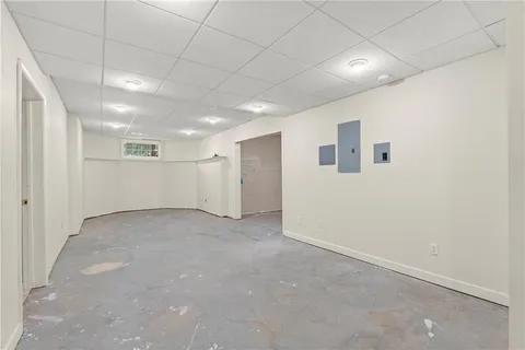 a balcony with wooden floor and fence