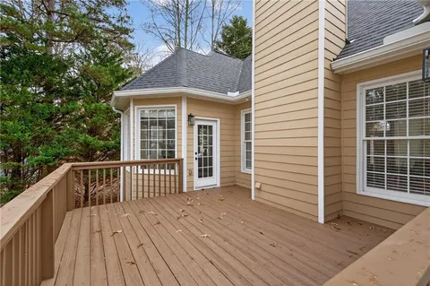 a front view of a house with a garden and yard