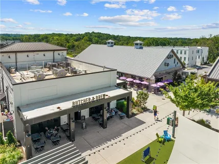 an aerial view of a building with outdoor seating