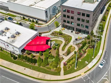 an aerial view of a swimming pool and outdoor space