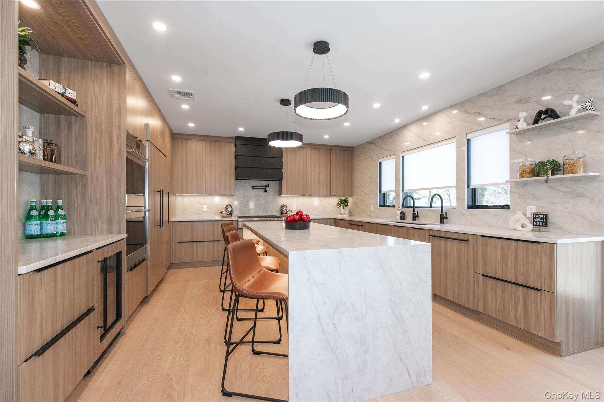 1 Bentley Road Great Neck, NY 11023 - Photo 11 of 34 a kitchen with stainless steel appliances kitchen island granite countertop a sink and cabinets