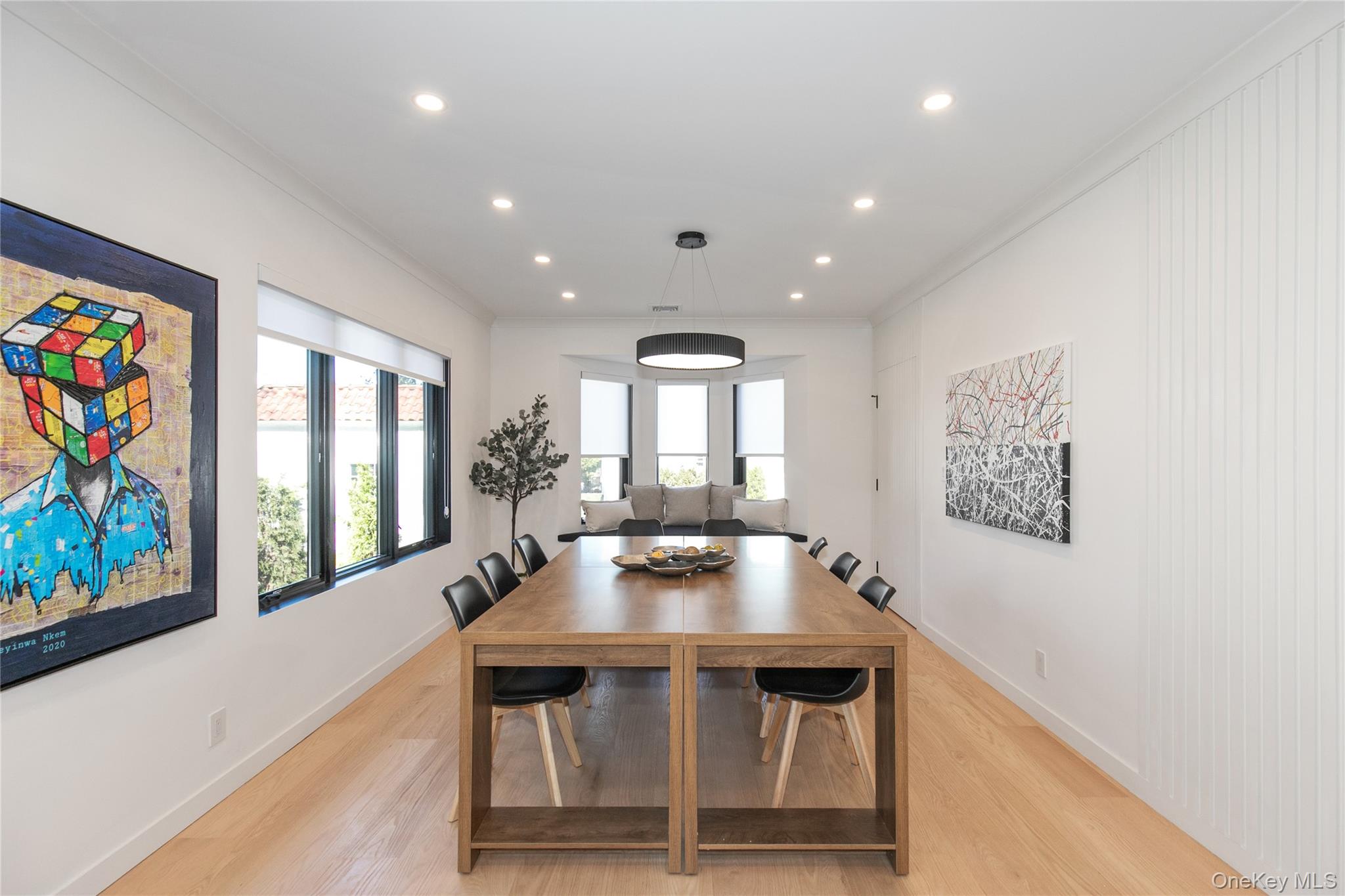 1 Bentley Road Great Neck, NY 11023 - Photo 15 of 34 a dining room with wooden floor and furniture