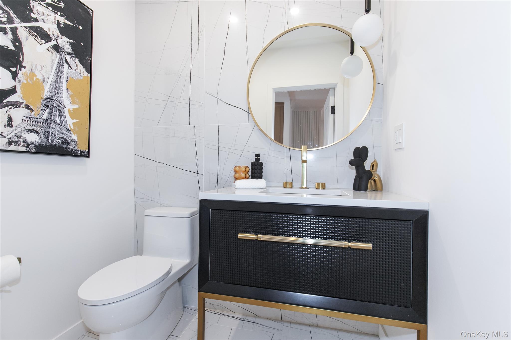 1 Bentley Road Great Neck, NY 11023 - Photo 16 of 34 a bathroom with a toilet a sink and mirror