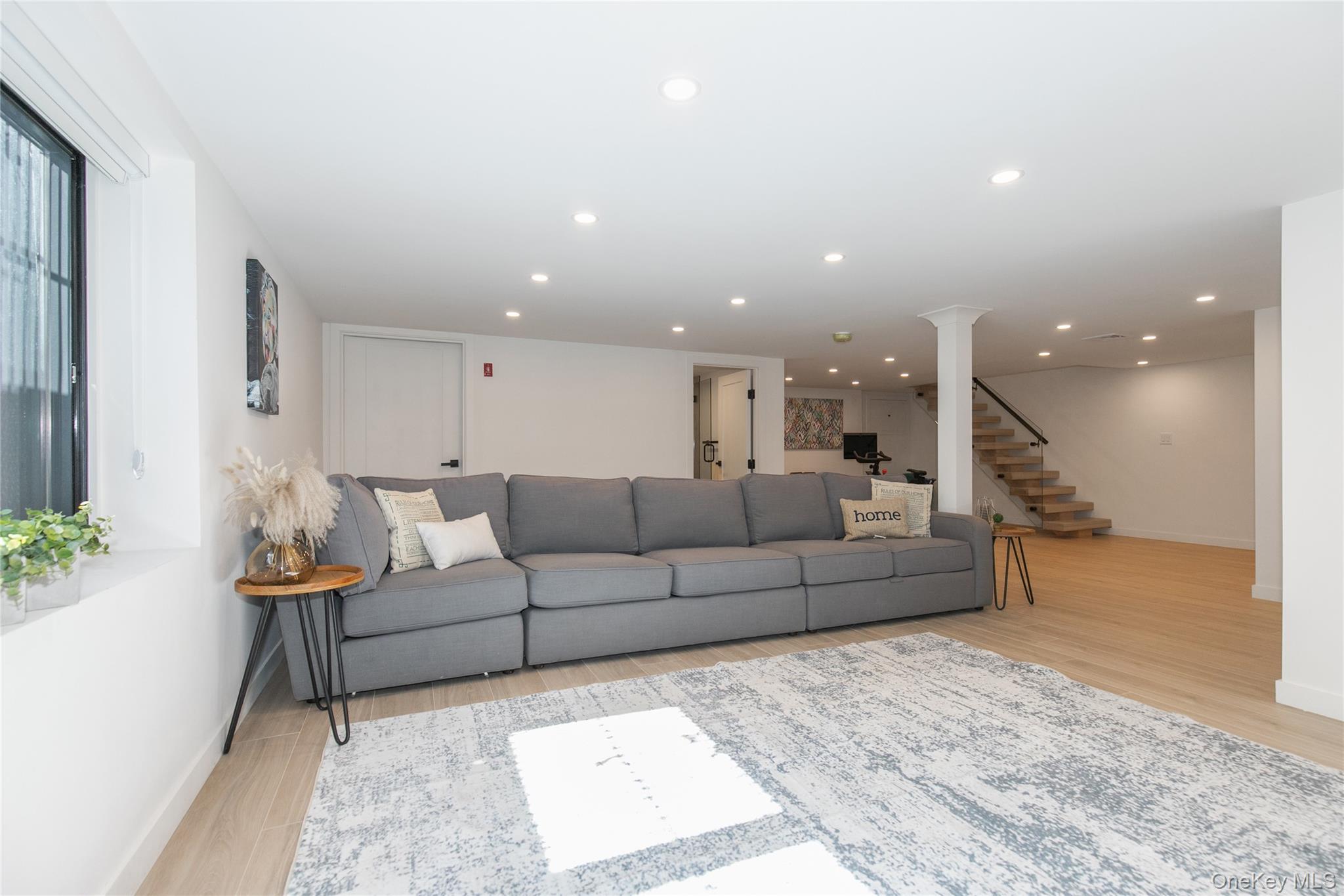 1 Bentley Road Great Neck, NY 11023 - Photo 28 of 34 a living room with furniture and a couch