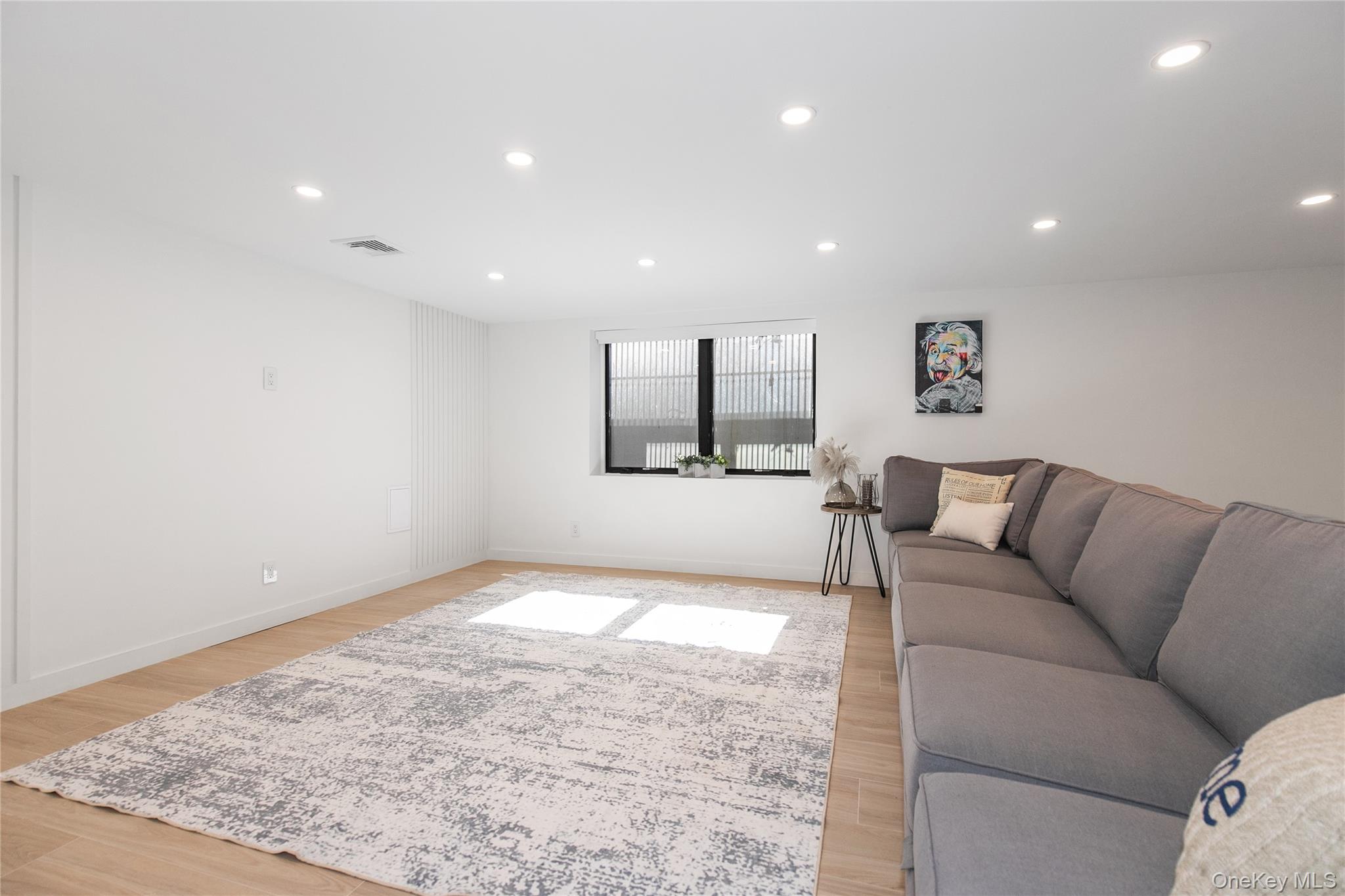 1 Bentley Road Great Neck, NY 11023 - Photo 29 of 34 a living room with furniture and a rug