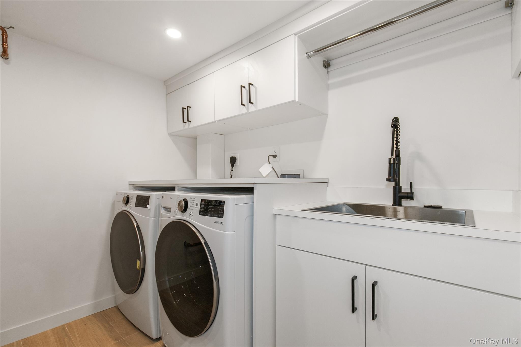 1 Bentley Road Great Neck, NY 11023 - Photo 30 of 34 a utility room with dryer and washer