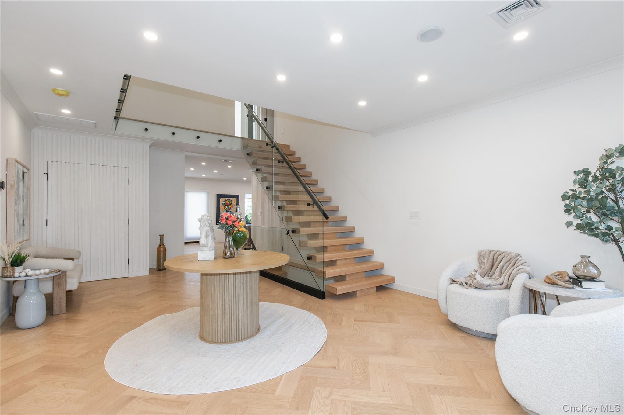 1 Bentley Road Great Neck, NY 11023 - Photo 4 of 34 a room with lots of white furniture and entryway