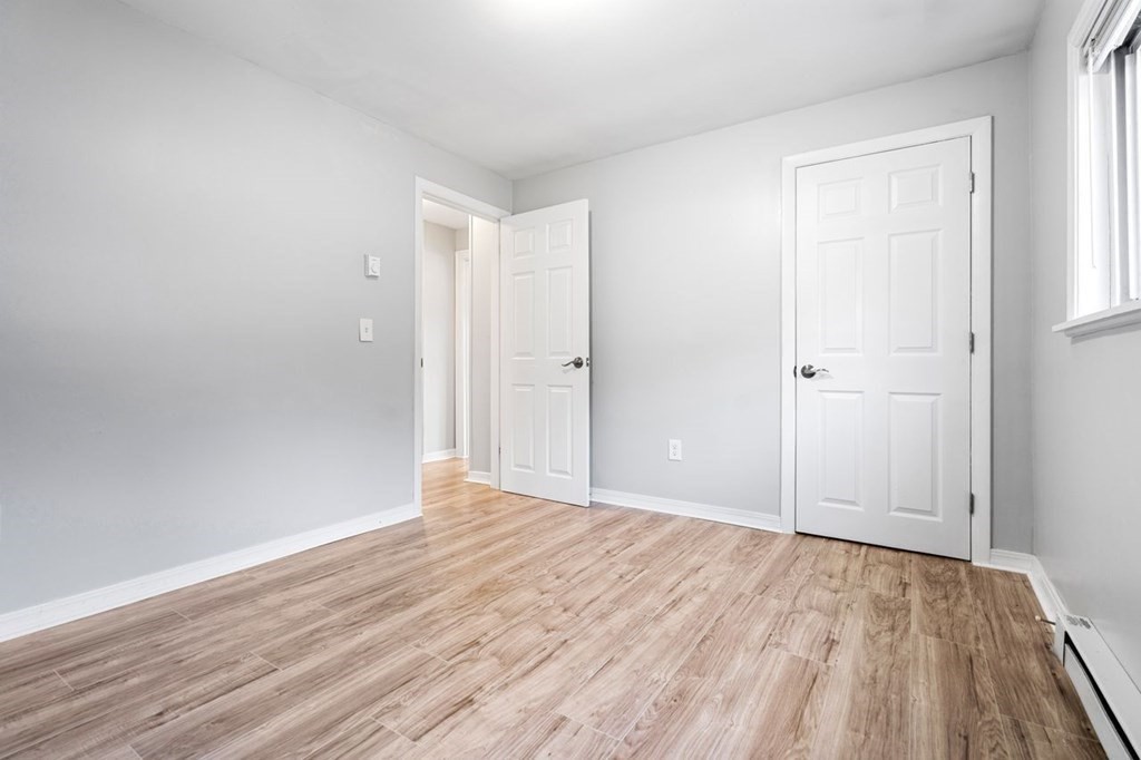 5 Turnpike Road, Unit 210 Townsend, MA 01469 - Photo 15 of 29 a view of an empty room with wooden floor