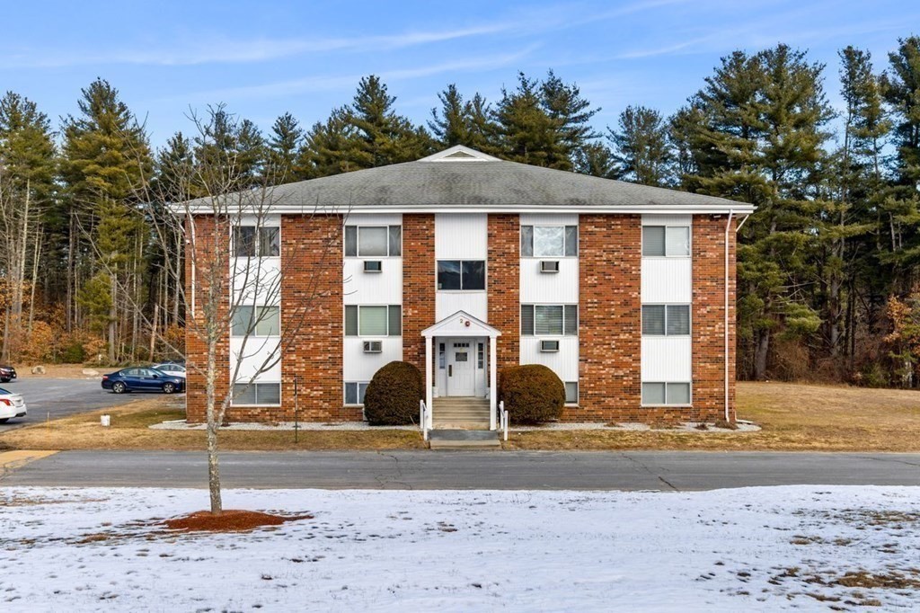 5 Turnpike Road, Unit 210 Townsend, MA 01469 - Photo 21 of 29 a front view of a house with a yard